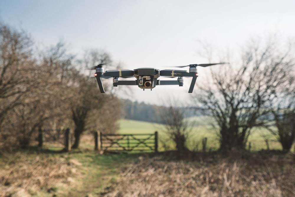 Picture of a drone over a farmland. 